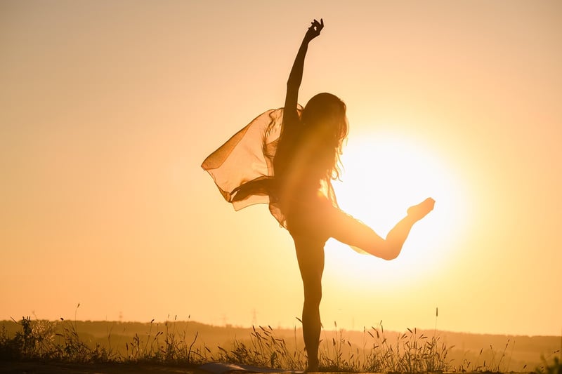 Woman practicing breath awareness at sunset
